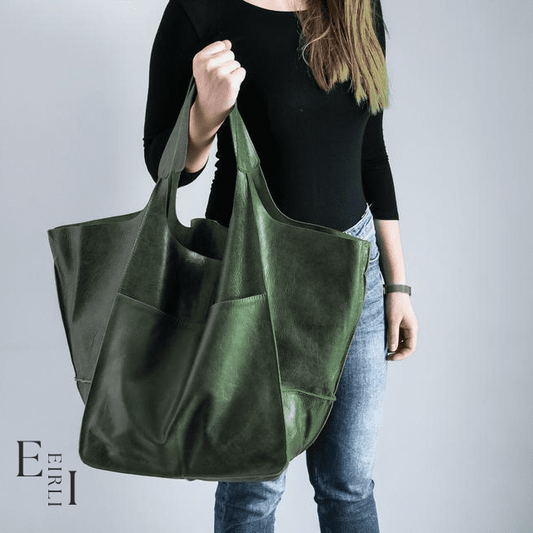 <img src="green-handbag.jpg" alt=" A beautiful green handbag carried by a woman official website www.eirlistore.com">
